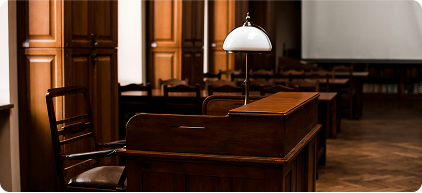 Photo of a wooden lectern and chair inside a room